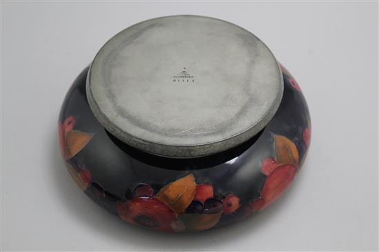 A William Moorcroft pomegranate pattern Tudric pewter mounted bowl, c.1920, 22cm, mount loose